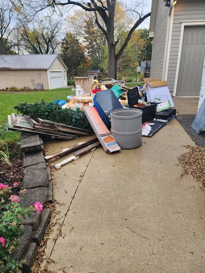 Dumpster being loaded with debris for Commercial Dumpster Rental in McCalla